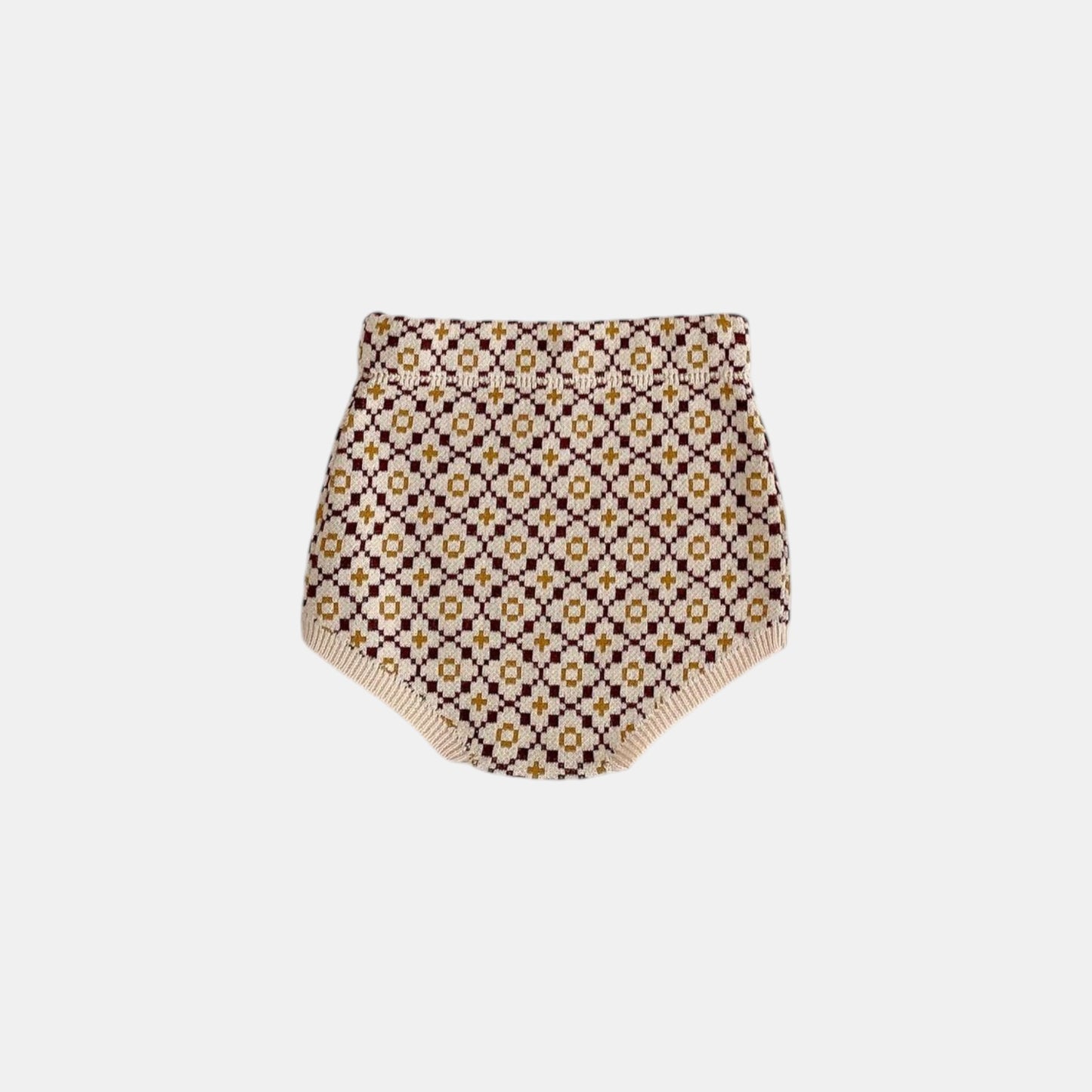 Back of floral patterned baby knit bloomers on a white background