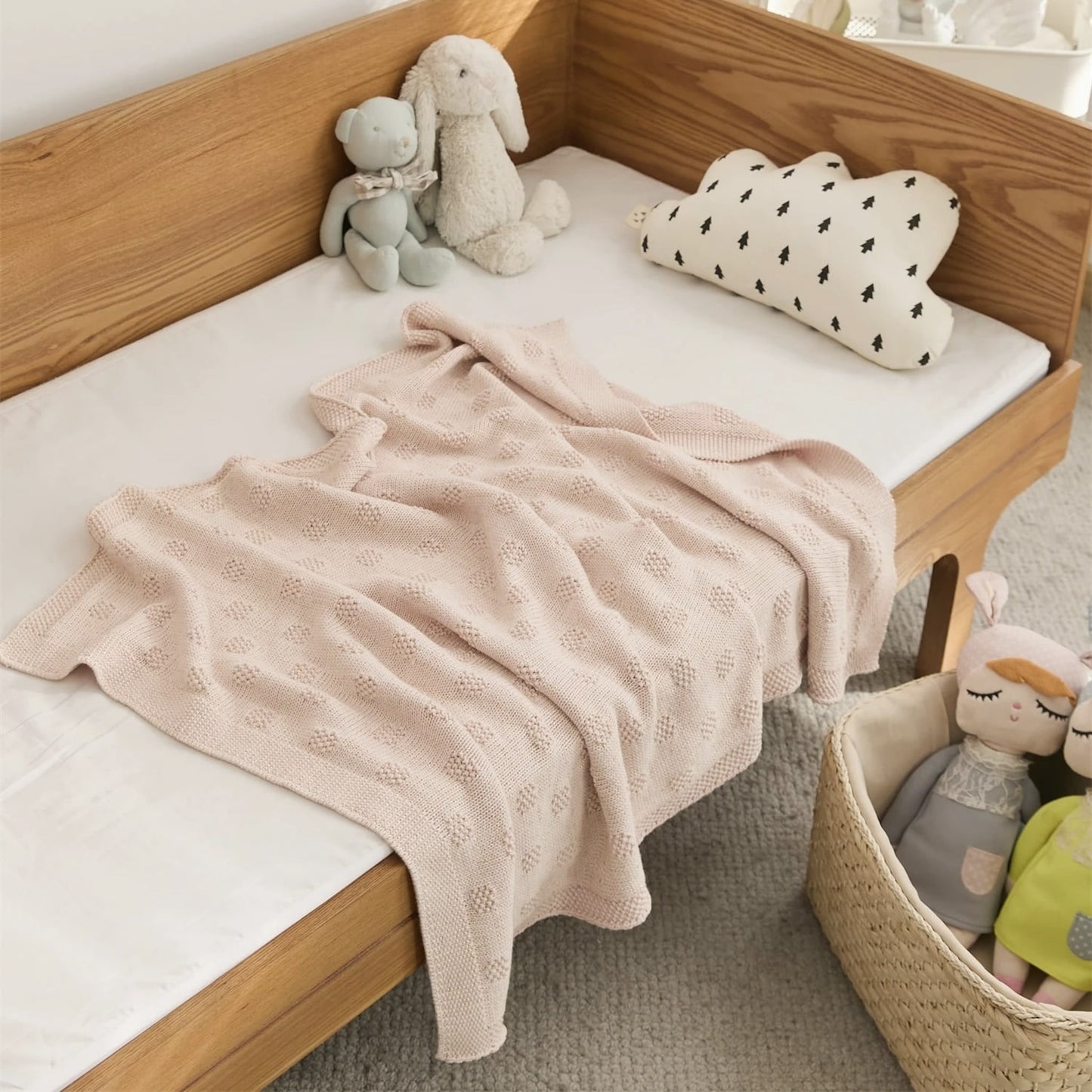OEKO-TEX® Blush Plaid Knitted Cotton Blanket - Draped on side of bed - Bambisserie