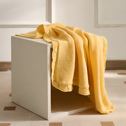 OEKO-TEX® Lullaby Knitted Cotton Blanket, Lemon Yellow - Draped over side table - Bambisserie