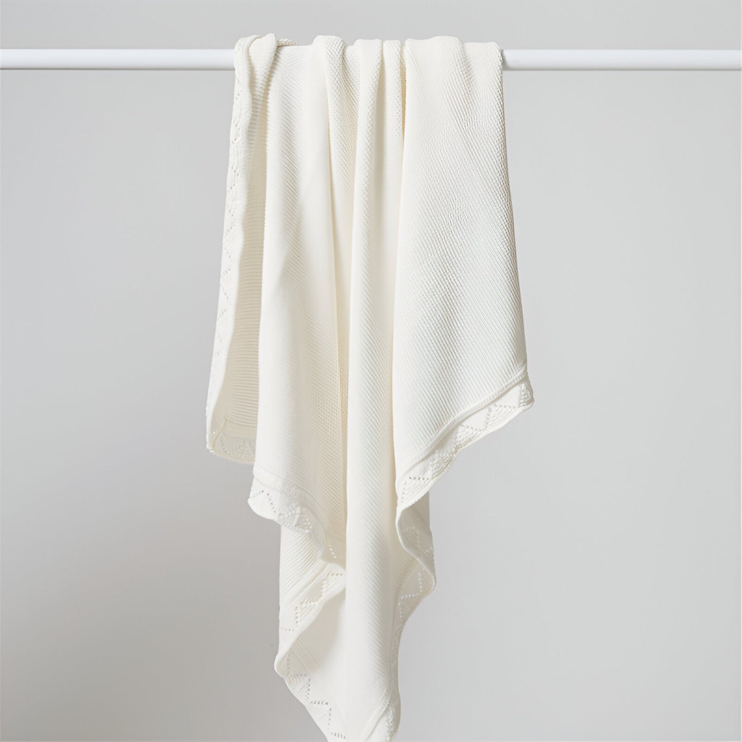 OEKO-TEX® Lullaby Knitted Cotton Blanket, White - Draped on pole - Bambisserie
