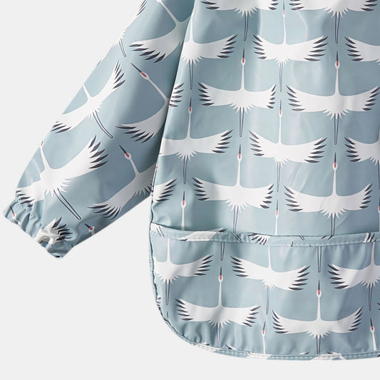 Waterproof Long Sleeve Pocket Bib, Flying Cranes - Detail - Bambisserie