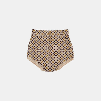 Patterned brown knitted baby bloomers on a white background