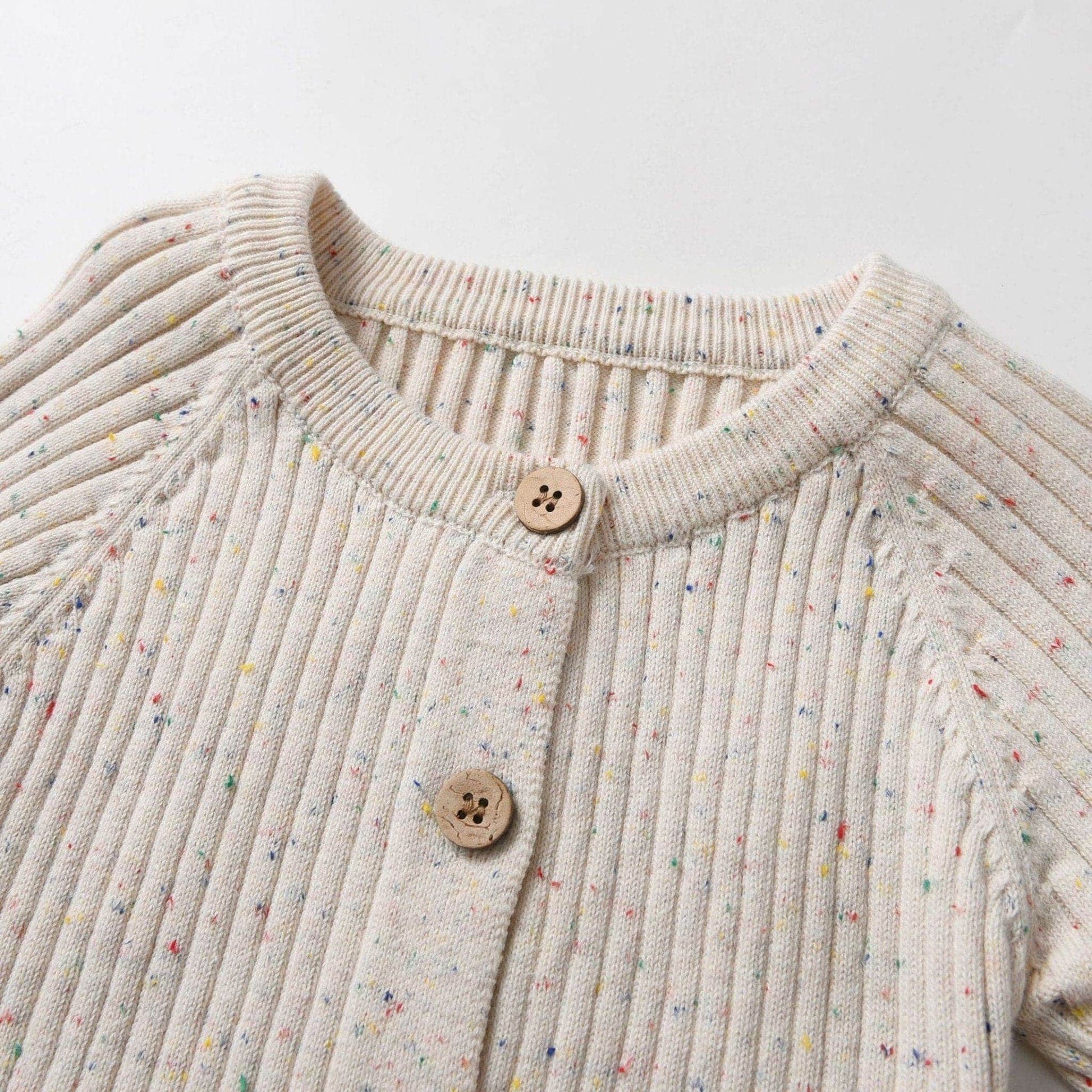 Almond Speckle Knitted Cotton Baby Jumpsuit Front Detail - Bambisserie