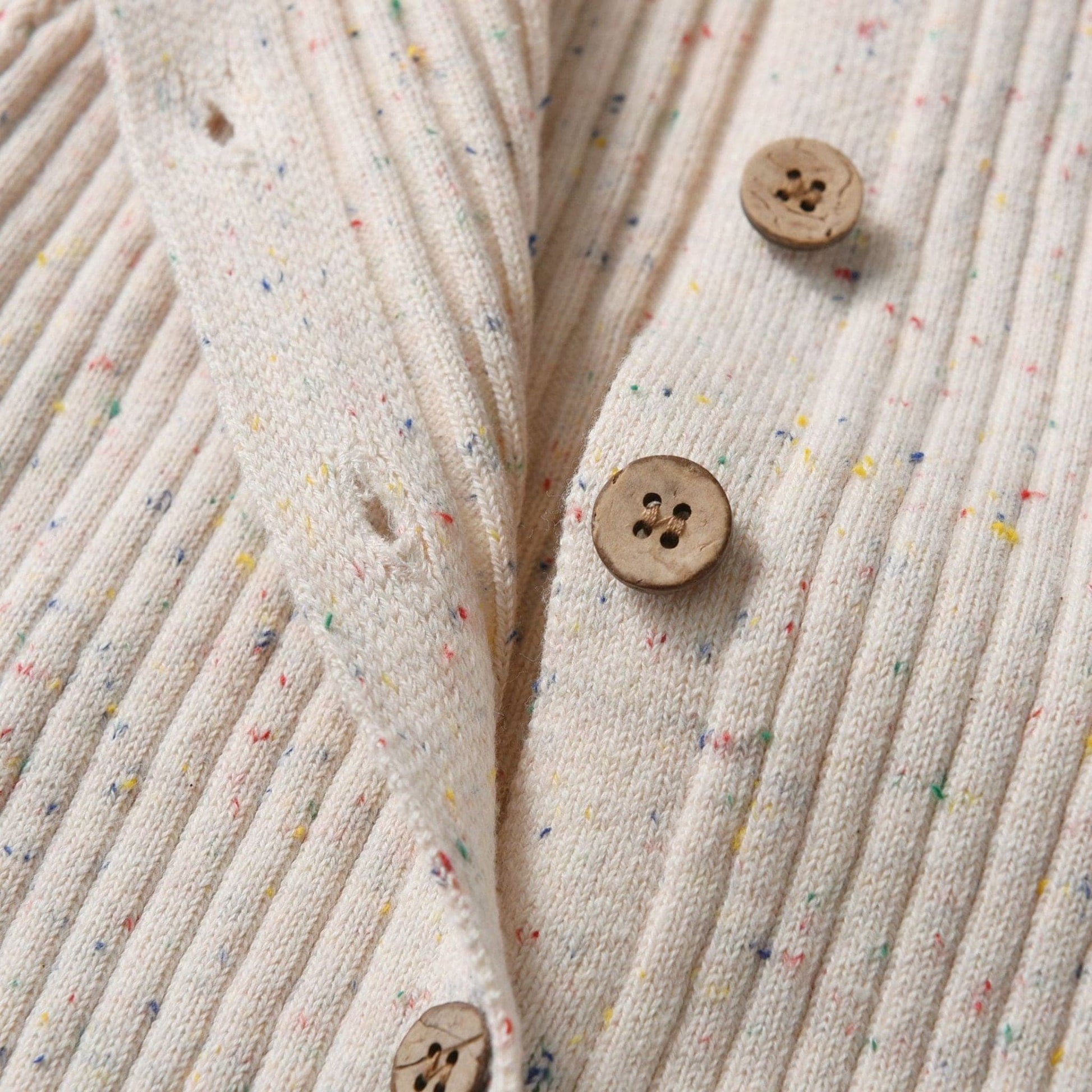 Almond Speckle Knitted Cotton Baby Jumpsuit Close Up Button - Bambisserie