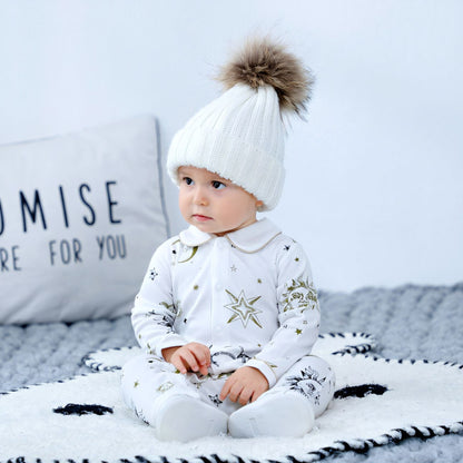 Baby sitting up wearing Apollo Sun GOTS Organic Cotton Baby Sleepsuit - Bambisserie