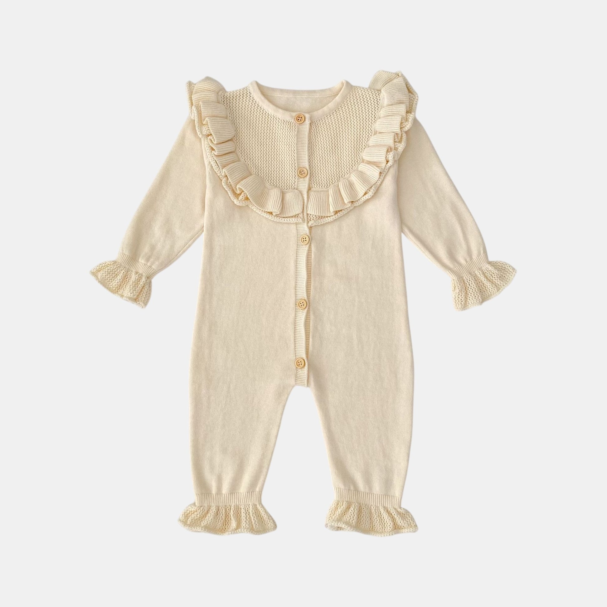 Cream baby romper with ruffled details on a light grey background