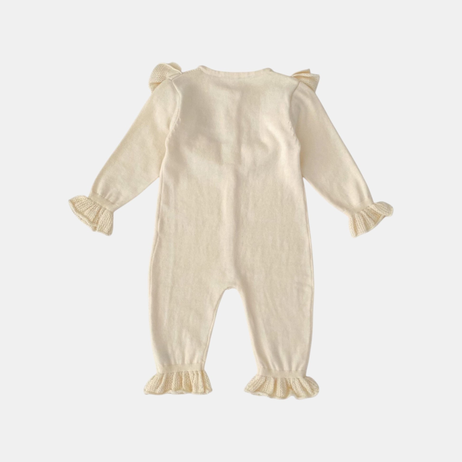 Back of cream baby romper with ruffled sleeves and legs on a white background