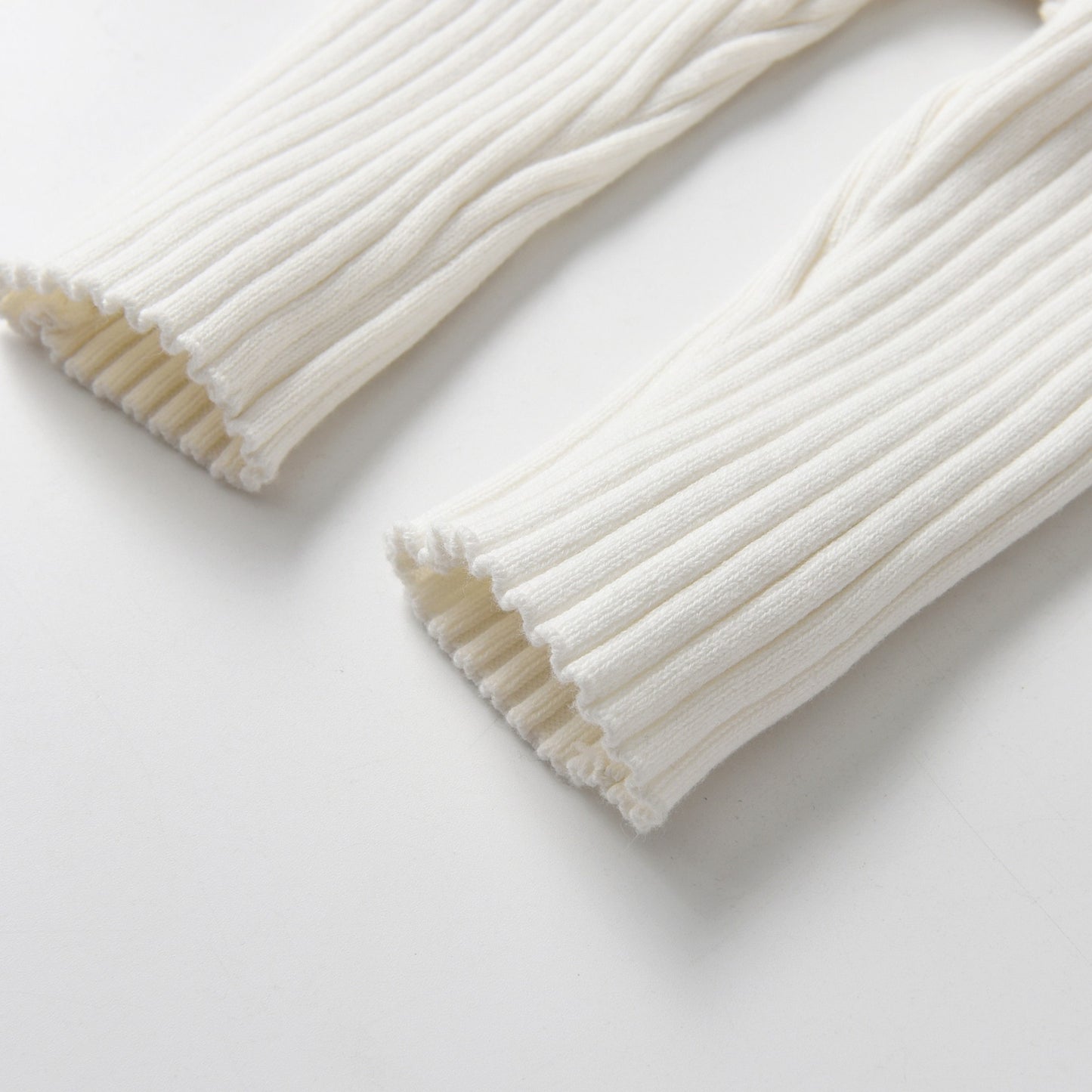 Ivory Knitted Cotton Baby Jumpsuit - Leg Detail - Bambisserie