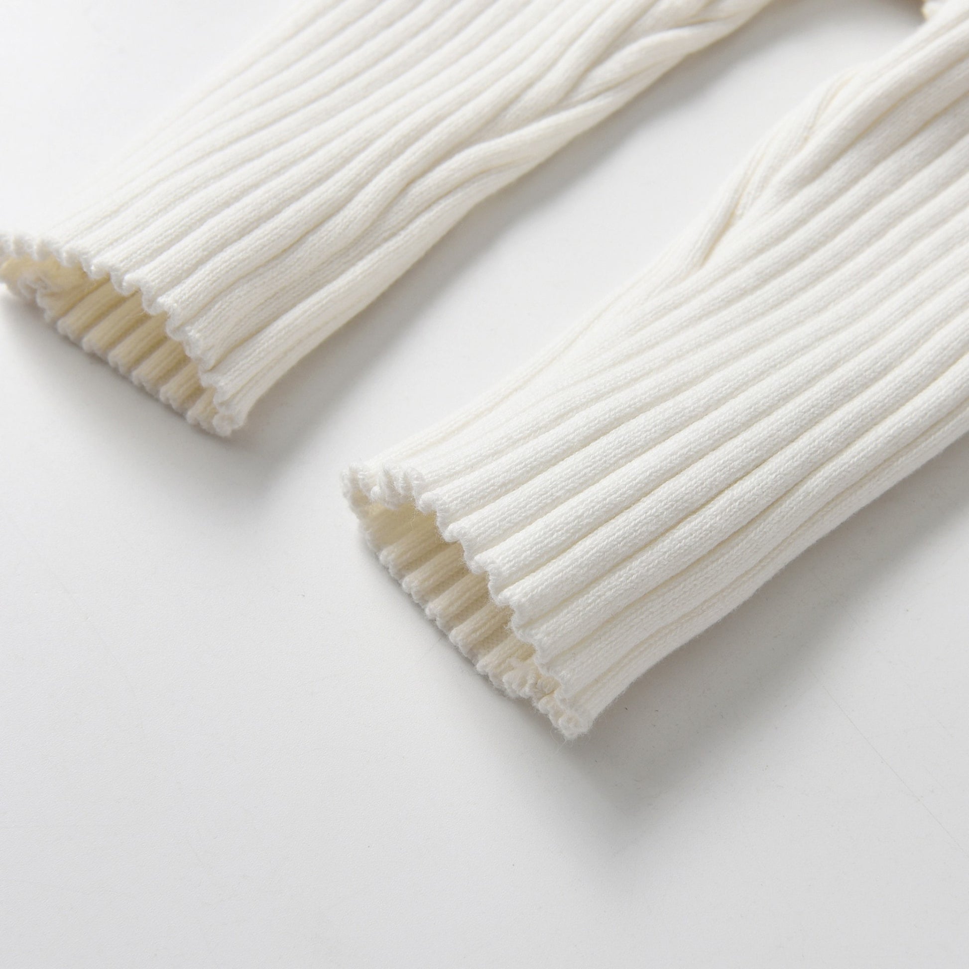 Ivory Knitted Cotton Baby Jumpsuit - Leg Detail - Bambisserie