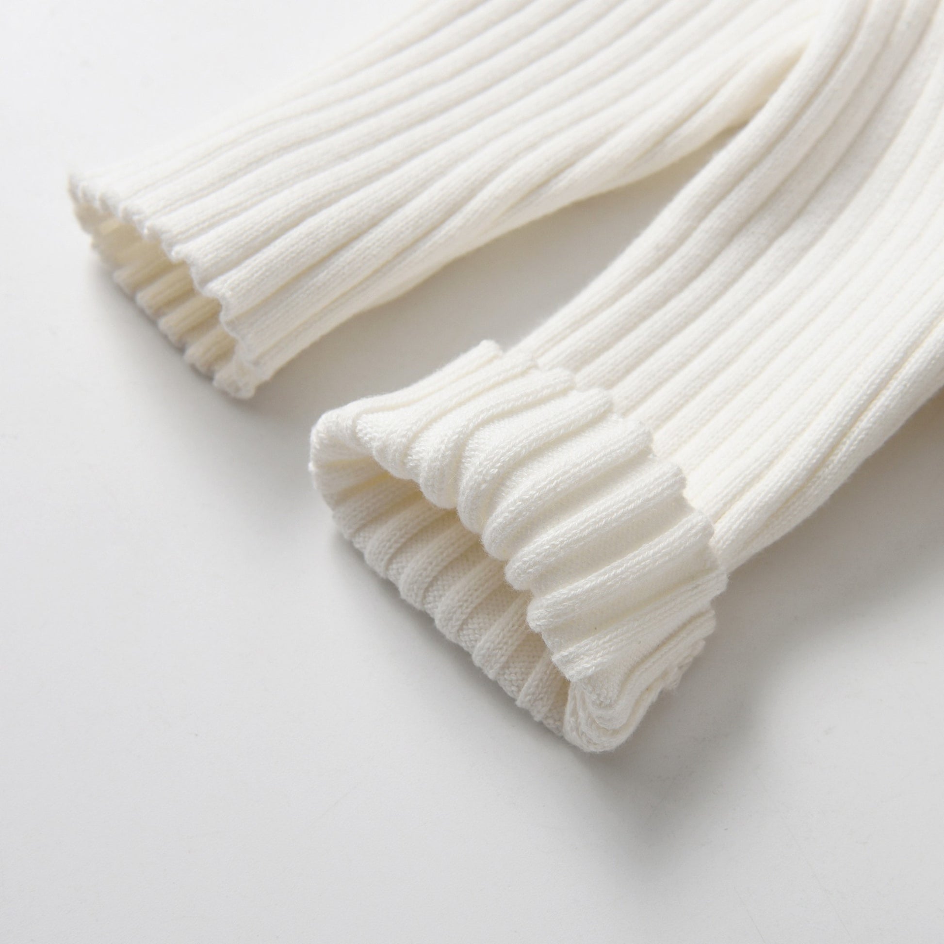 Ivory Knitted Cotton Baby Jumpsuit - Leg Detail Folded - Bambisserie