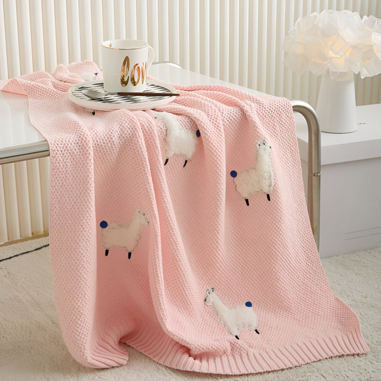 OEKO-TEX® Alpaca Knitted Cotton Blanket, Ballet Pink - Draped on side of table  - Bambisserie