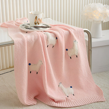 OEKO-TEX® Alpaca Knitted Cotton Blanket, Ballet Pink - Draped on side of table  - Bambisserie