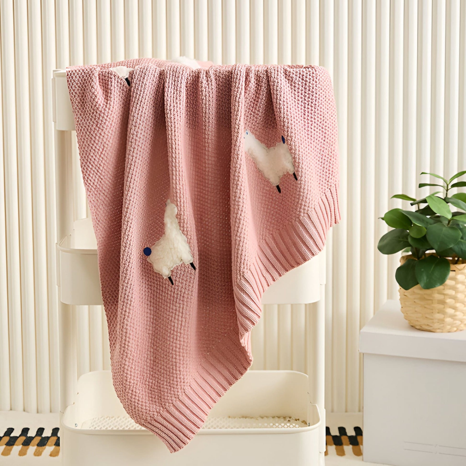 OEKO-TEX® Alpaca Knitted Cotton Blanket, Rose Pink - Draped on white trolley - Bambisserie