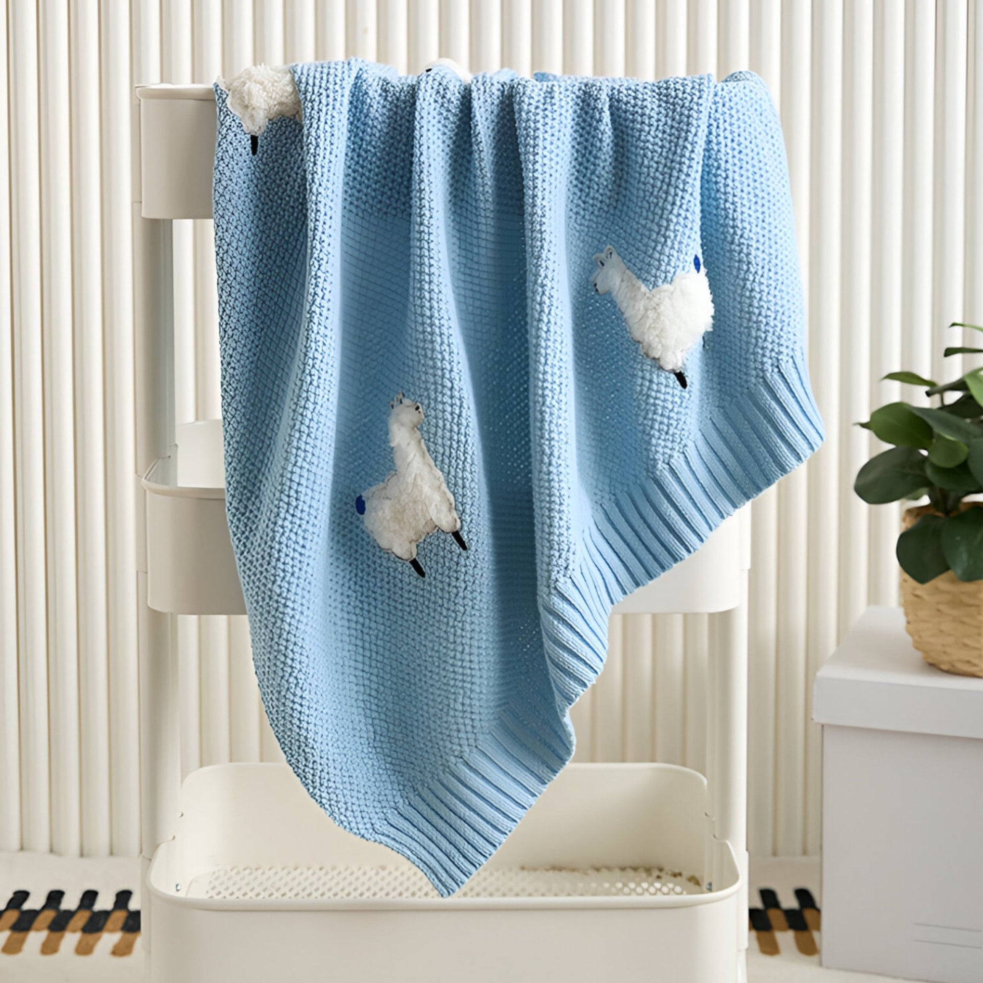 OEKO-TEX® Alpaca Knitted Cotton Blanket, Sky Blue - Draped on white trolley - Bambisserie