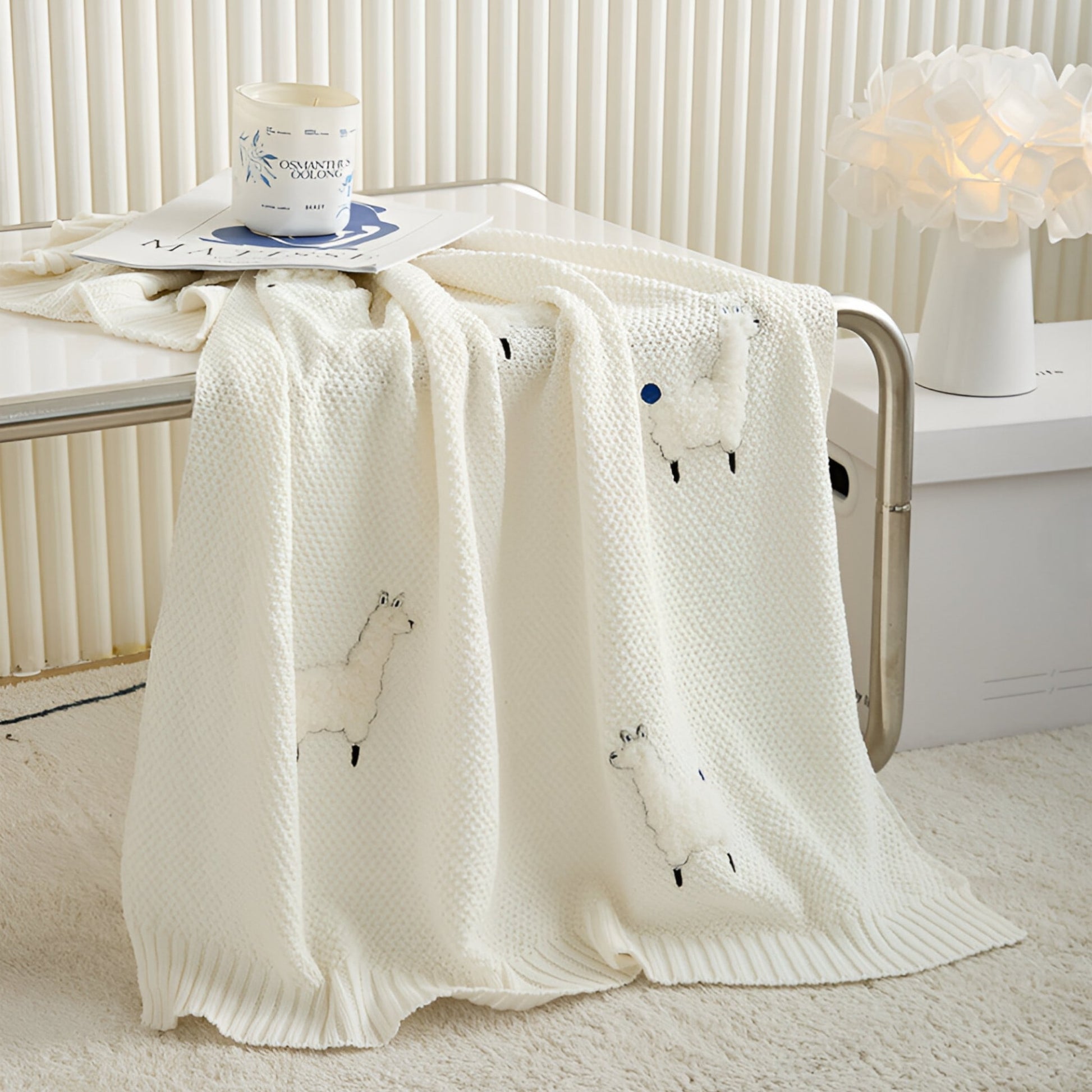 OEKO-TEX® Alpaca Knitted Cotton Blanket, White - Draped on side of table - Bambisserie