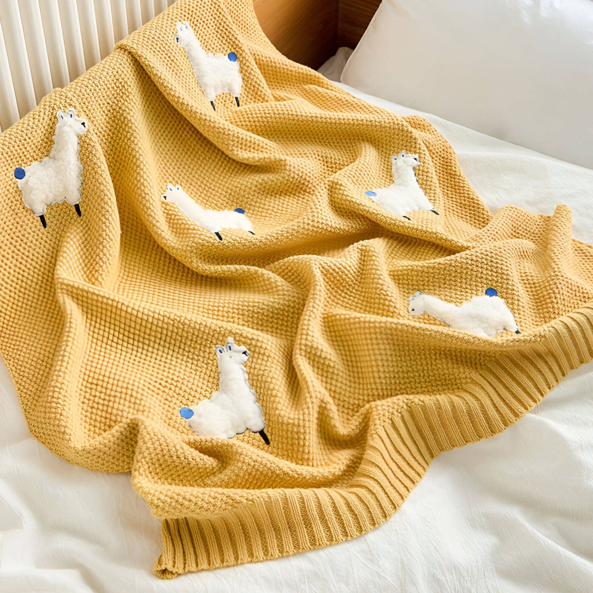 OEKO-TEX® Alpaca Knitted Cotton Blanket, Yellow - Draped on side of bed - Bambisserie