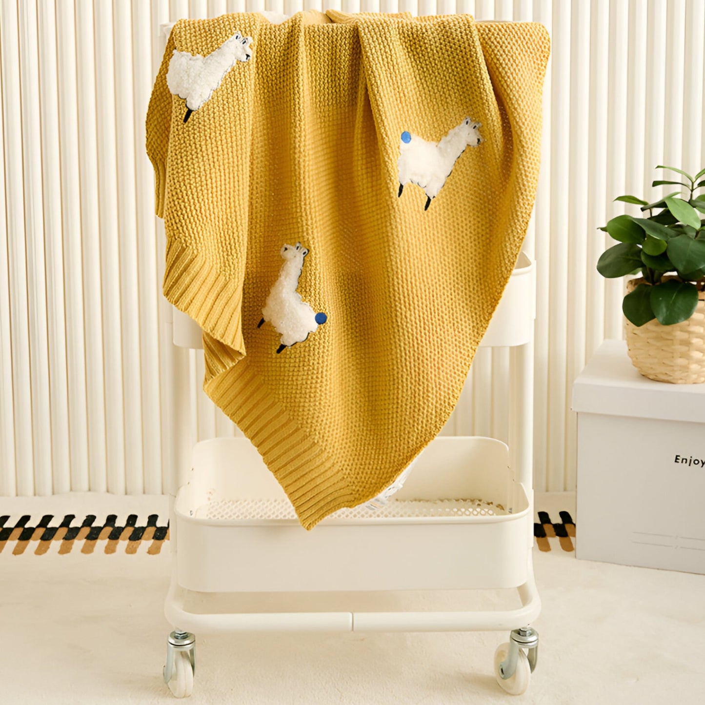 OEKO-TEX® Alpaca Knitted Cotton Blanket, Yellow - Draped on white trolley - Bambisserie