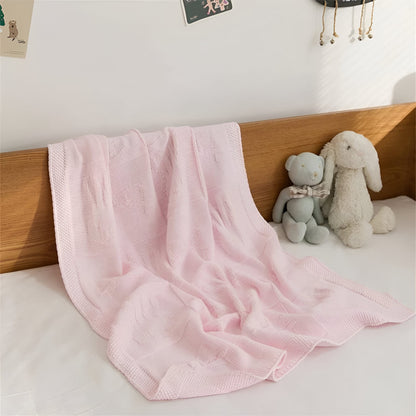 OEKO-TEX® Pink Bunny Knitted Cotton Blanket - Draped on bed - Bambisserie
