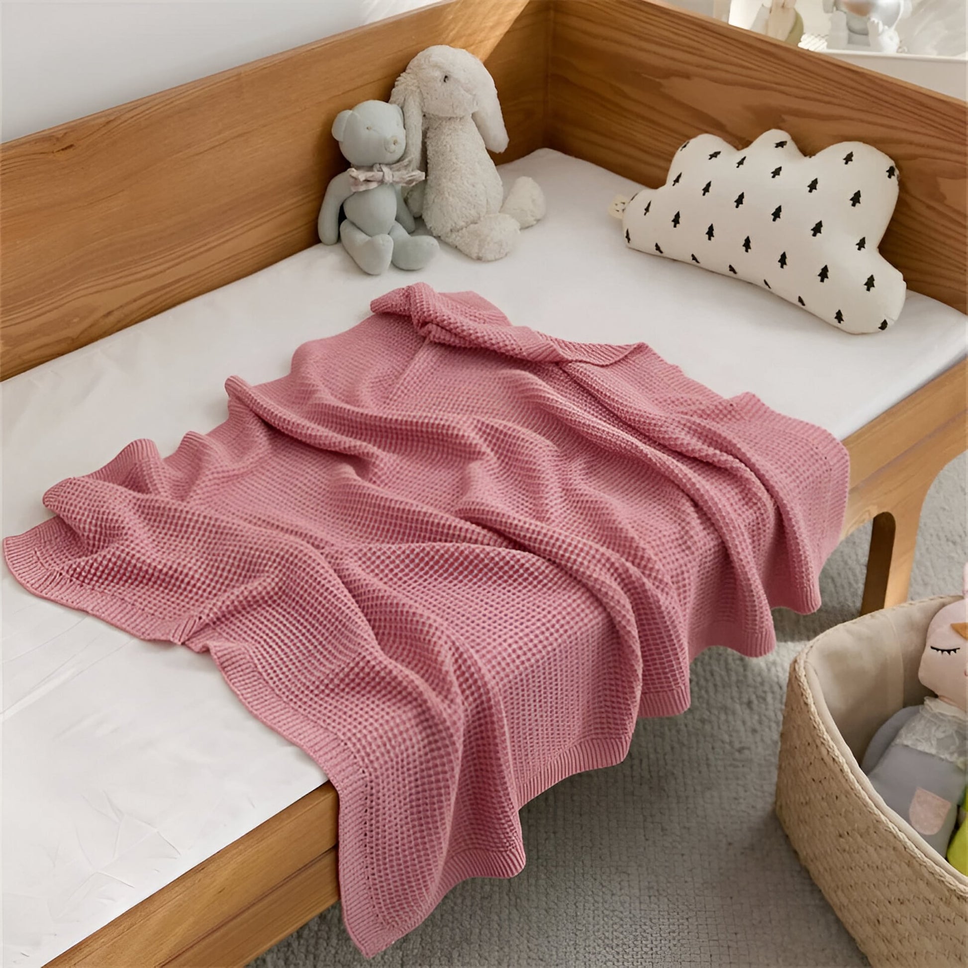 OEKO-TEX® Pink Waffle Knitted Cotton Blanket - Draped on side of bed - Bambisserie