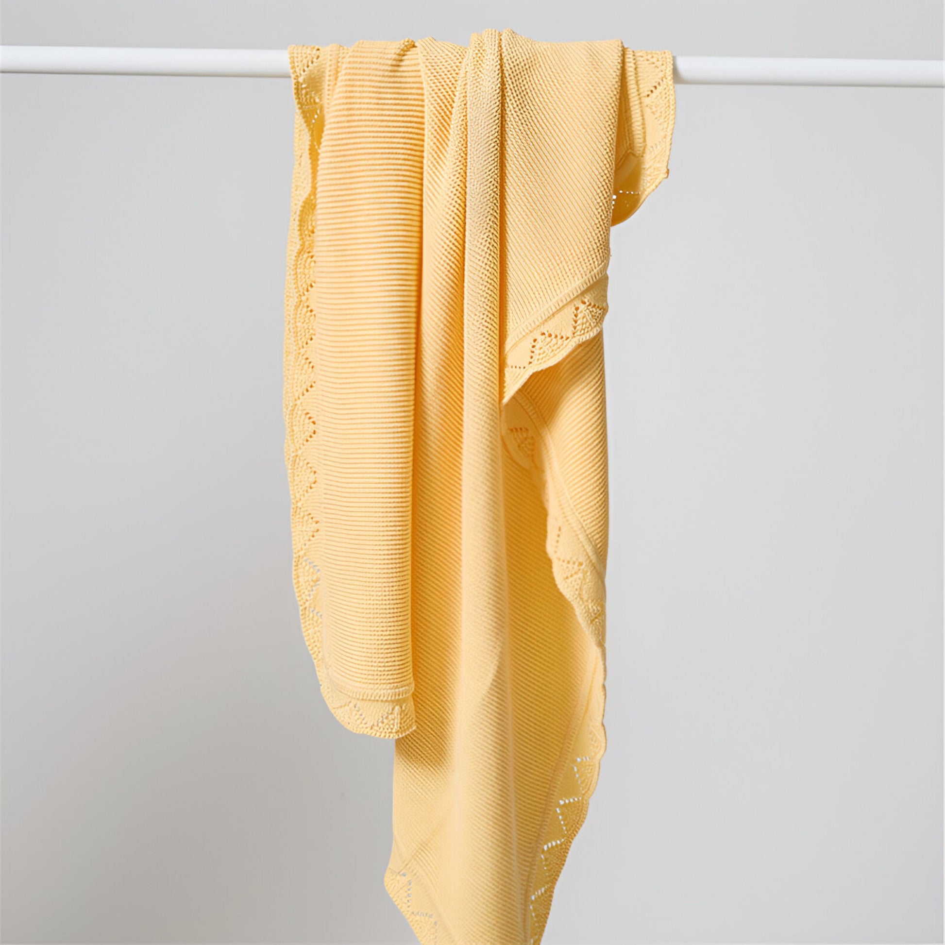 OEKO-TEX® Lullaby Knitted Cotton Blanket, Lemon Yellow - Draped on pole - Bambisserie