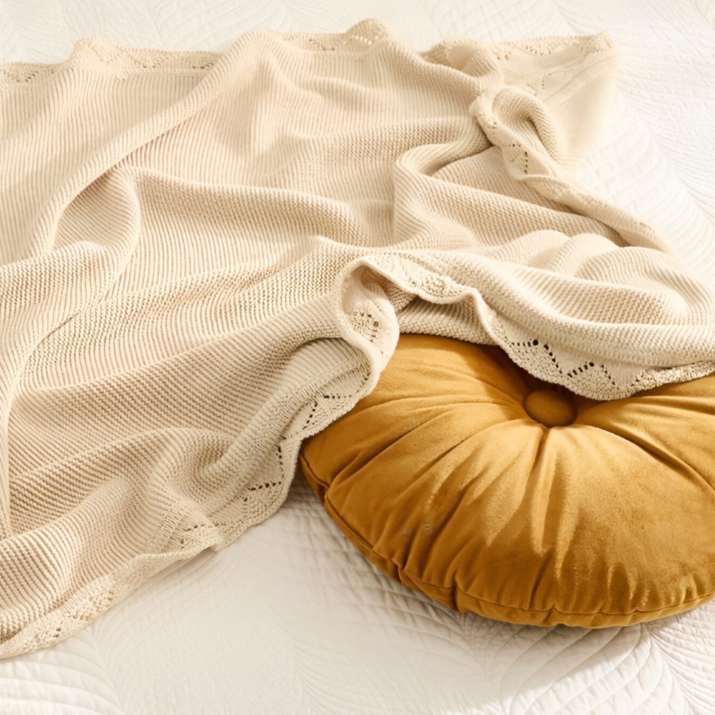 OEKO-TEX® Lullaby Knitted Cotton Blanket, Oat - Draped over round pillow - Bambisserie