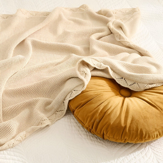 OEKO-TEX® Lullaby Knitted Cotton Blanket, Oat - Draped over round pillow - Bambisserie