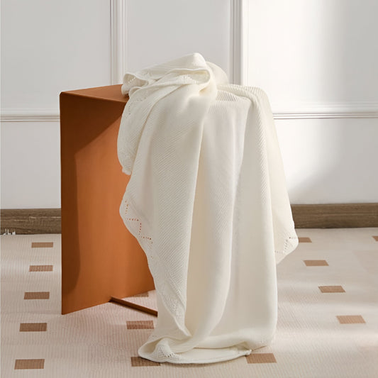 OEKO-TEX® Lullaby Knitted Cotton Blanket, White - Draped on table -  Bambisserie