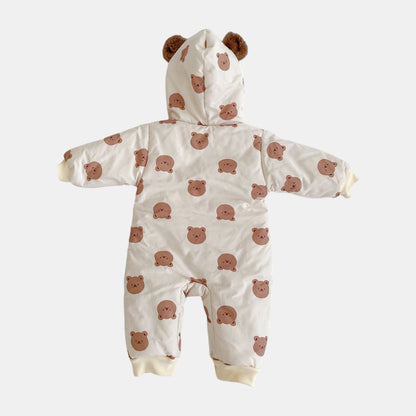 Cream baby pramsuit with bear pattern on a white background